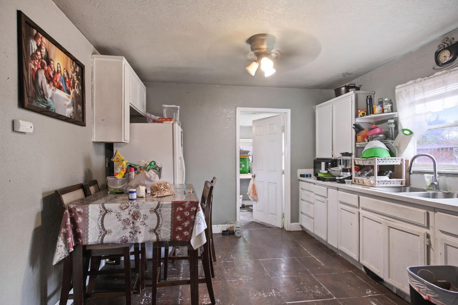1225 Eugene Avenue Modesto, CA 95351 - Photo 7 of 39 a view of a dining room with furniture and chandelier