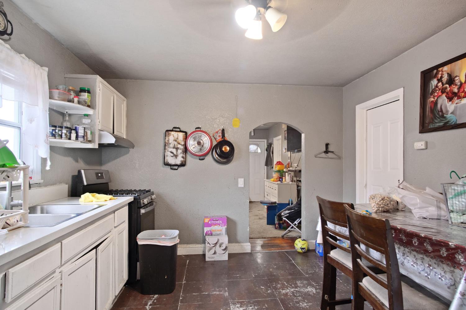1225 Eugene Avenue Modesto, CA 95351 - Photo 9 of 39 a kitchen with a sink and cabinets