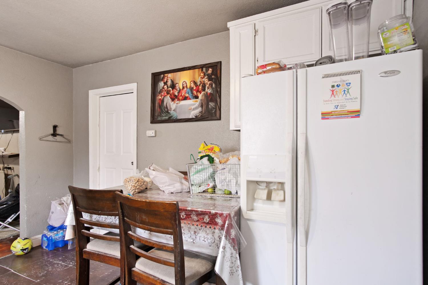 1225 Eugene Avenue Modesto, CA 95351 - Photo 10 of 39 a dining room with furniture and wooden floor