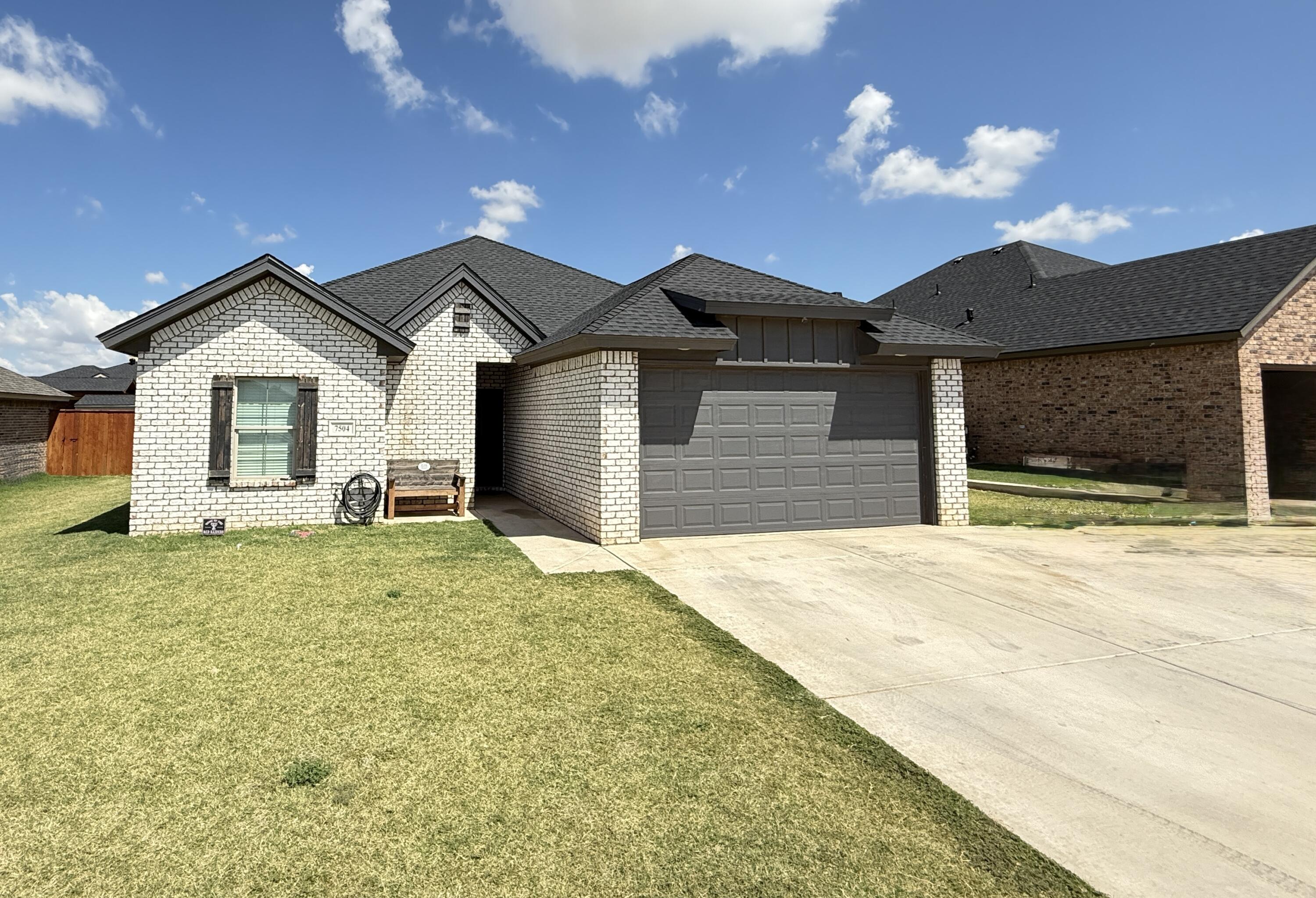 7504 87th Street Lubbock, TX 79424 - Photo 2 of 33 a bathroom with a sink and a yard