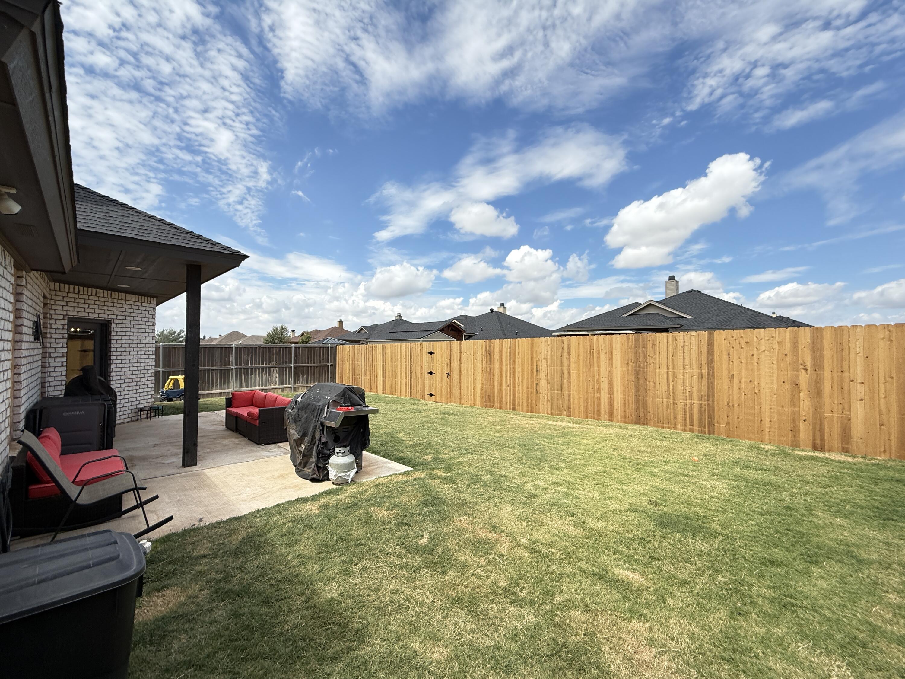 7504 87th Street Lubbock, TX 79424 - Photo 29 of 33 a backyard of a house with table and chairs