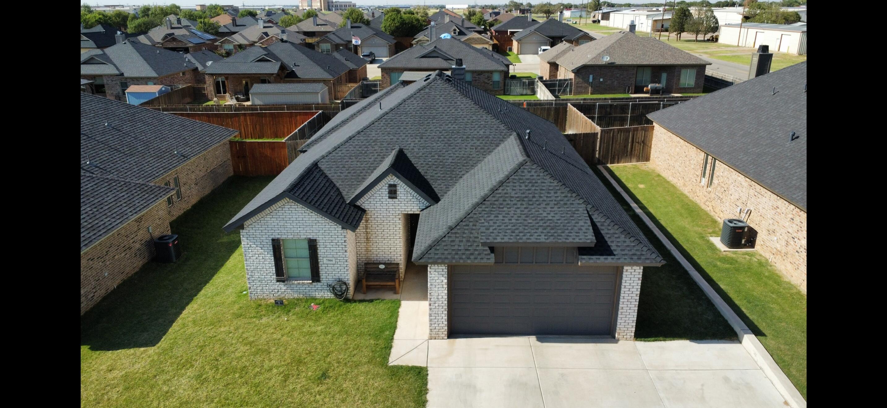 7504 87th Street Lubbock, TX 79424 - Photo 32 of 33 an aerial view of a house with swimming pool