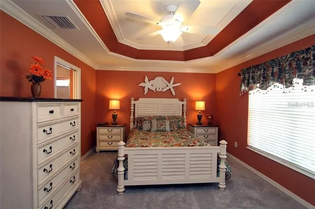 a bed room with a bed and a dresser