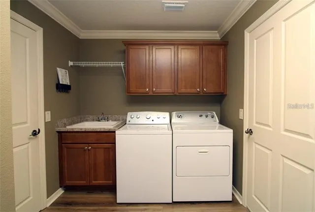 a utility room with dryer and washer