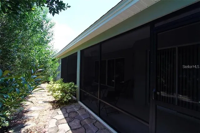 a backyard of a house with potted plants