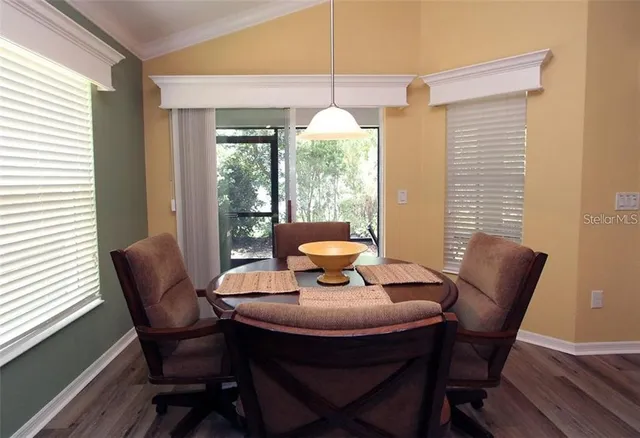 a view of a dining room with furniture window and outside view