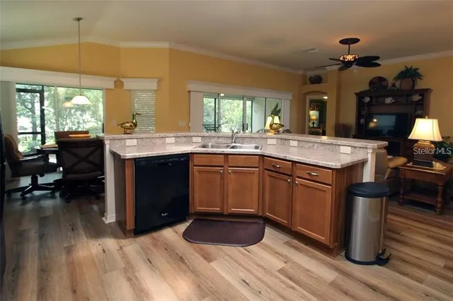 a kitchen with a sink and cabinets