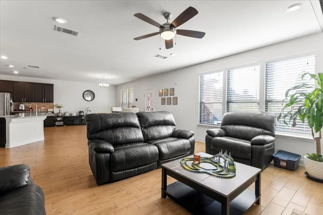 a living room with furniture and a large window