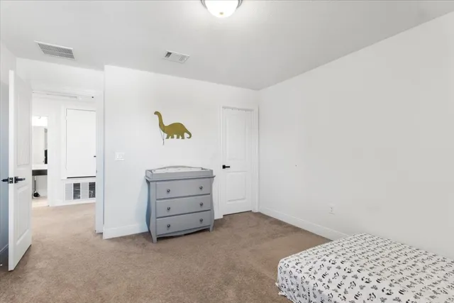 a view of room with cabinet and air conditioner