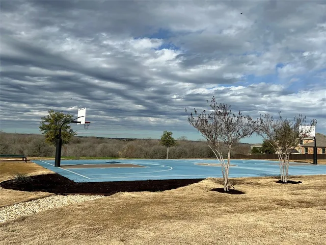 a view of a swimming pool with an outdoor seating