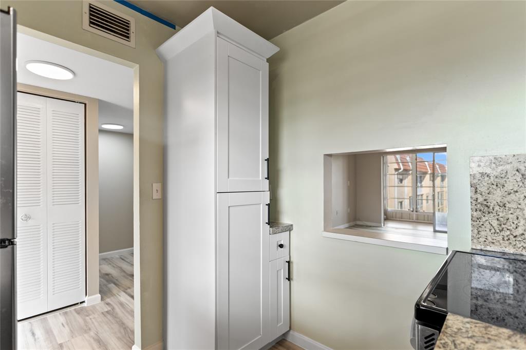 2720 North Pine Island Road, Unit 307 Sunrise, FL 33322 - Photo 14 of 40 a view of front door and bedroom