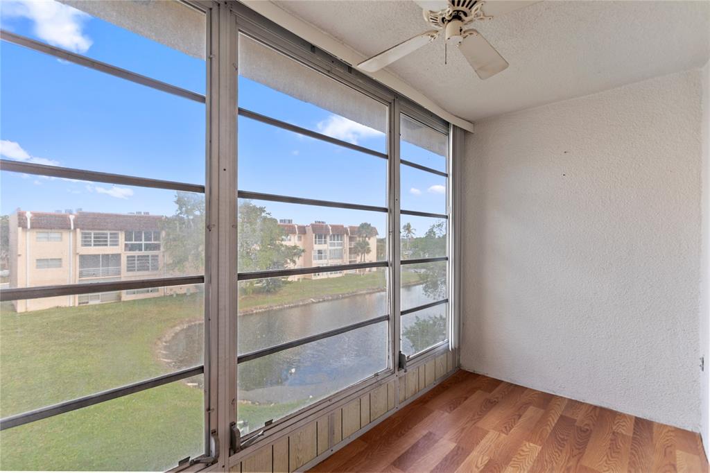2720 North Pine Island Road, Unit 307 Sunrise, FL 33322 - Photo 23 of 40 a view of a room with wooden floor and cabinet