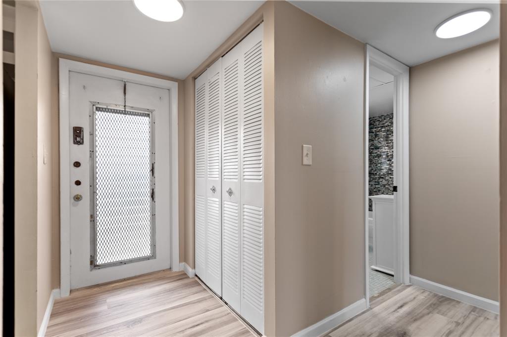 2720 North Pine Island Road, Unit 307 Sunrise, FL 33322 - Photo 28 of 40 a view of hallway with wooden floor