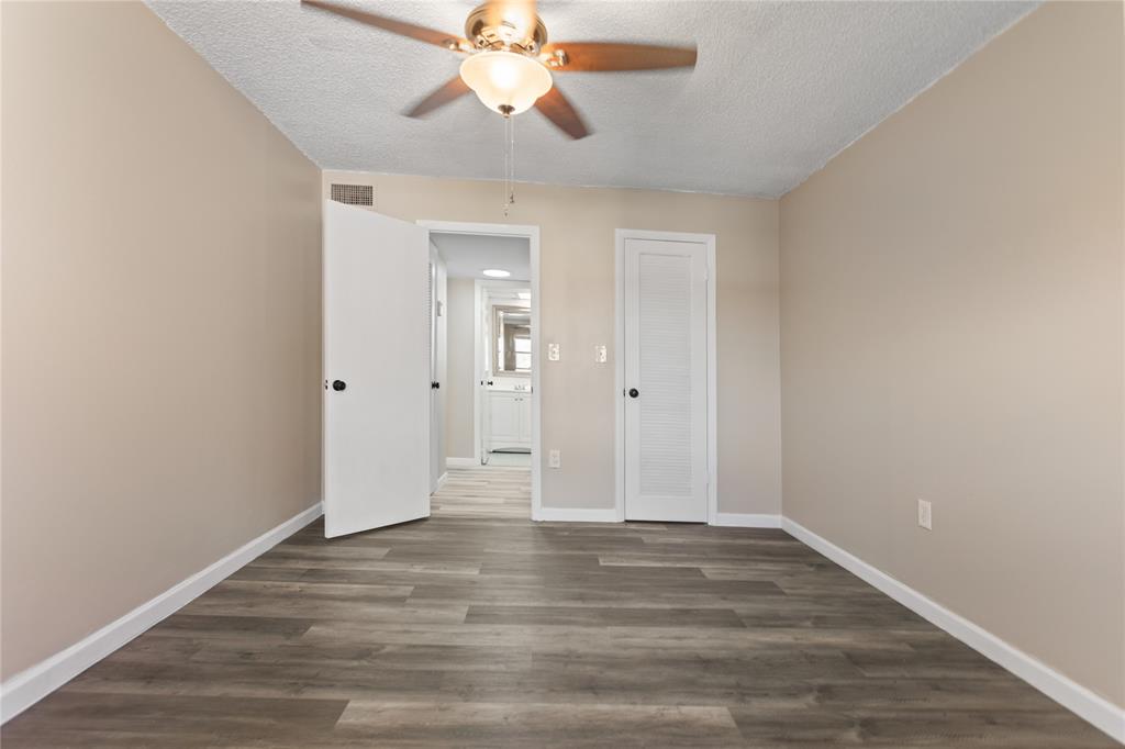 2720 North Pine Island Road, Unit 307 Sunrise, FL 33322 - Photo 37 of 40 wooden floor in an empty room with a window