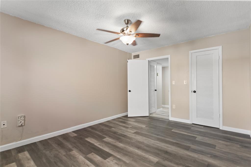 2720 North Pine Island Road, Unit 307 Sunrise, FL 33322 - Photo 38 of 40 a view of a room with wooden floor and ceiling fan