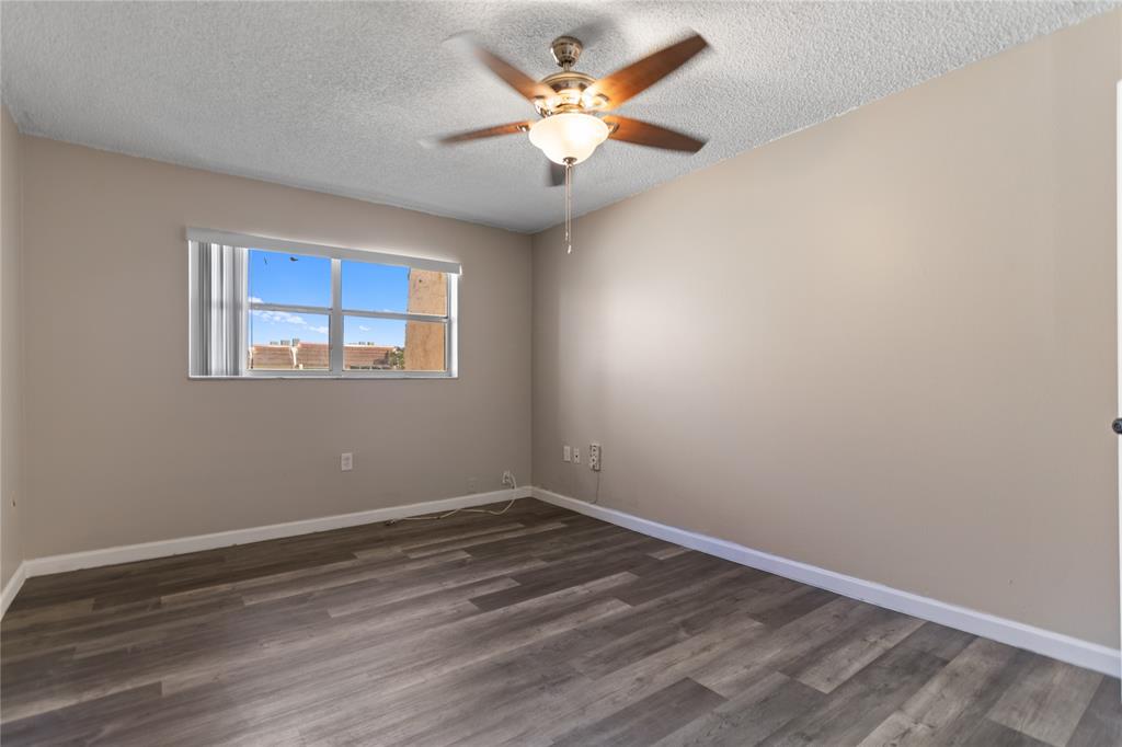 2720 North Pine Island Road, Unit 307 Sunrise, FL 33322 - Photo 39 of 40 a view of an empty room with a window