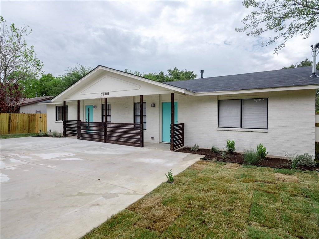 7000 Circle S Road, Unit A Austin, TX 78745 - Photo 1 of 1 a front view of a house with garden