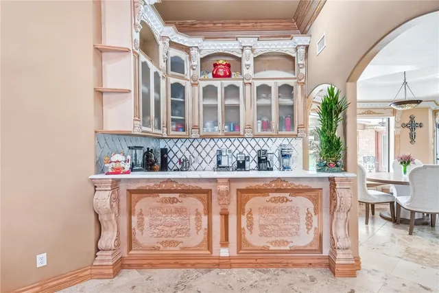 a view of a kitchen with a sink and cabinets