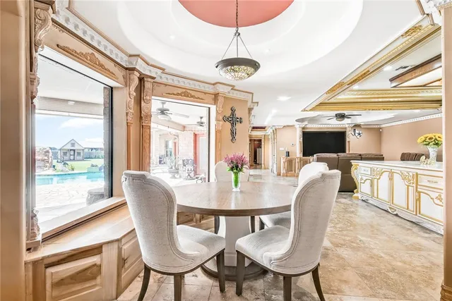 a view of a kitchen with stainless steel appliances granite countertop a sink and cabinets