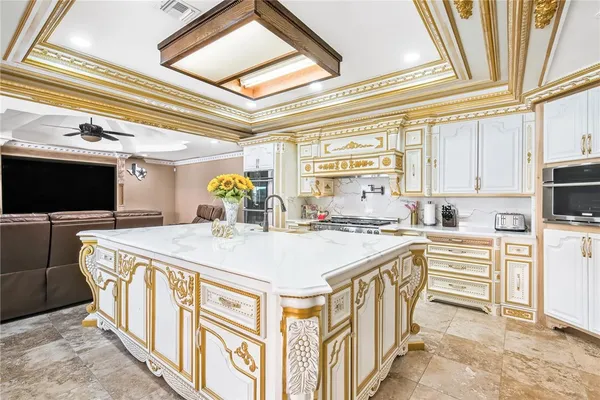 a kitchen with stainless steel appliances granite countertop a stove and a refrigerator