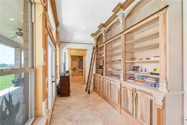 a bathroom with a tub a sink and a large mirror