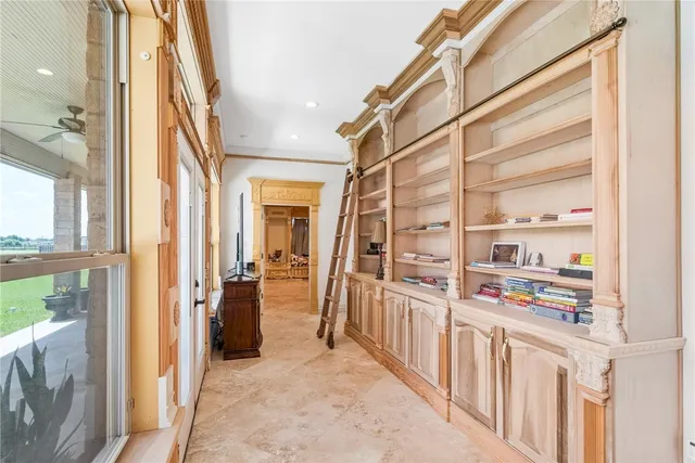 a bathroom with a tub a sink and a large mirror