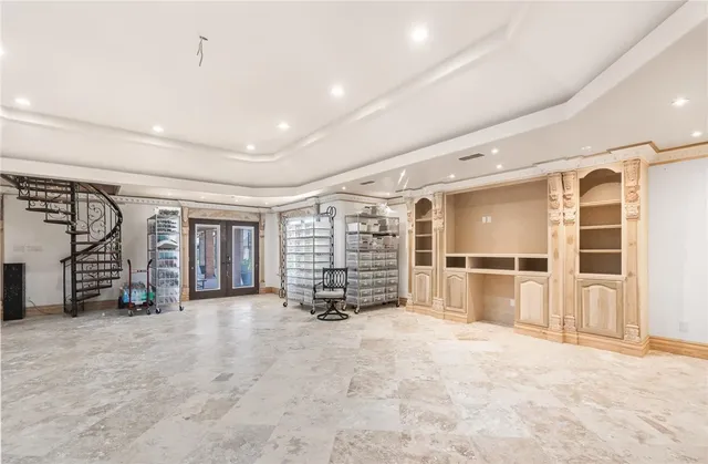 a kitchen with granite countertop a sink stove and cabinets