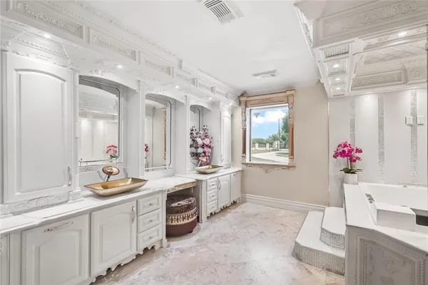 a kitchen with a stove a sink and a refrigerator