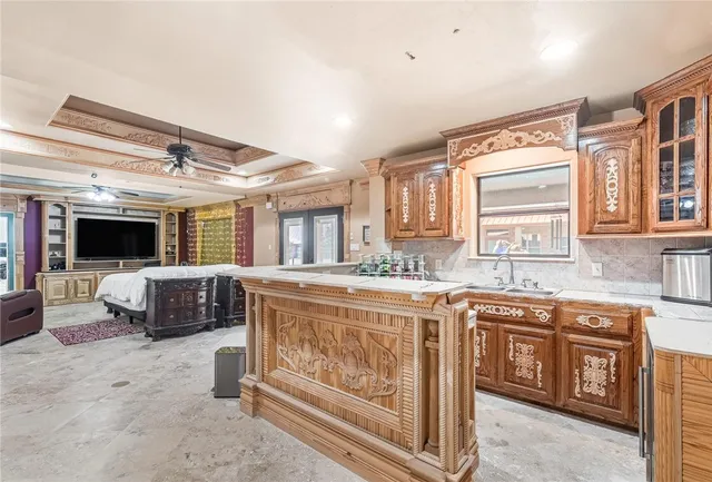 a kitchen with a stove a sink and a refrigerator