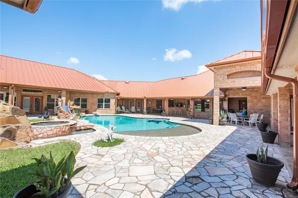 a view of a chairs and table in the patio