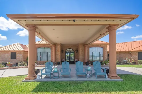 an aerial view of residential houses with outdoor space and swimming pool