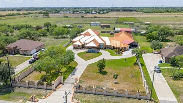 an aerial view of a house with a lake view