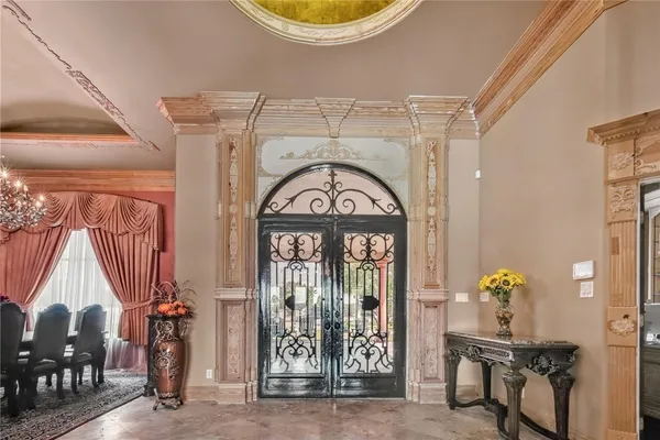 a living room with fireplace furniture and a chandelier