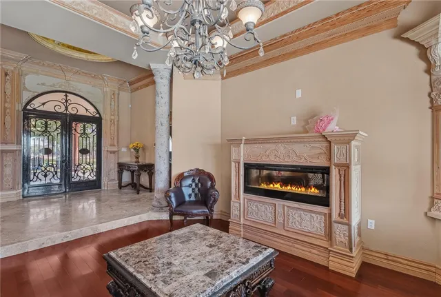 a view of a dining room with furniture and chandelier