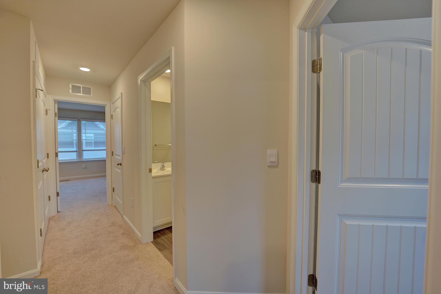 21 Crowberry Drive Magnolia, DE 19962 - Photo 21 of 38 a view of a hallway with wooden floor