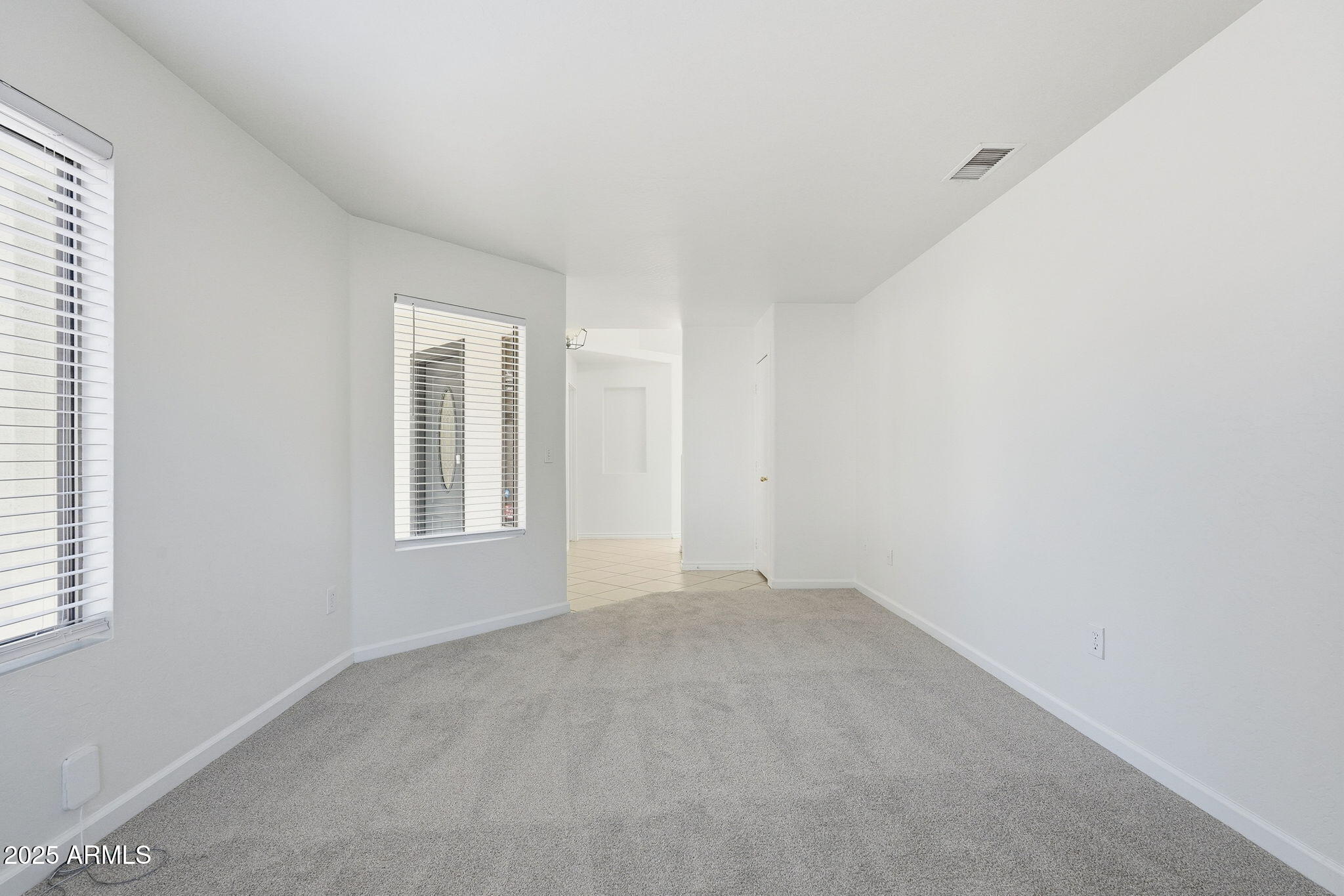 2061 East Appaloosa Road Gilbert, AZ 85296 - Photo 9 of 37 an empty room with windows