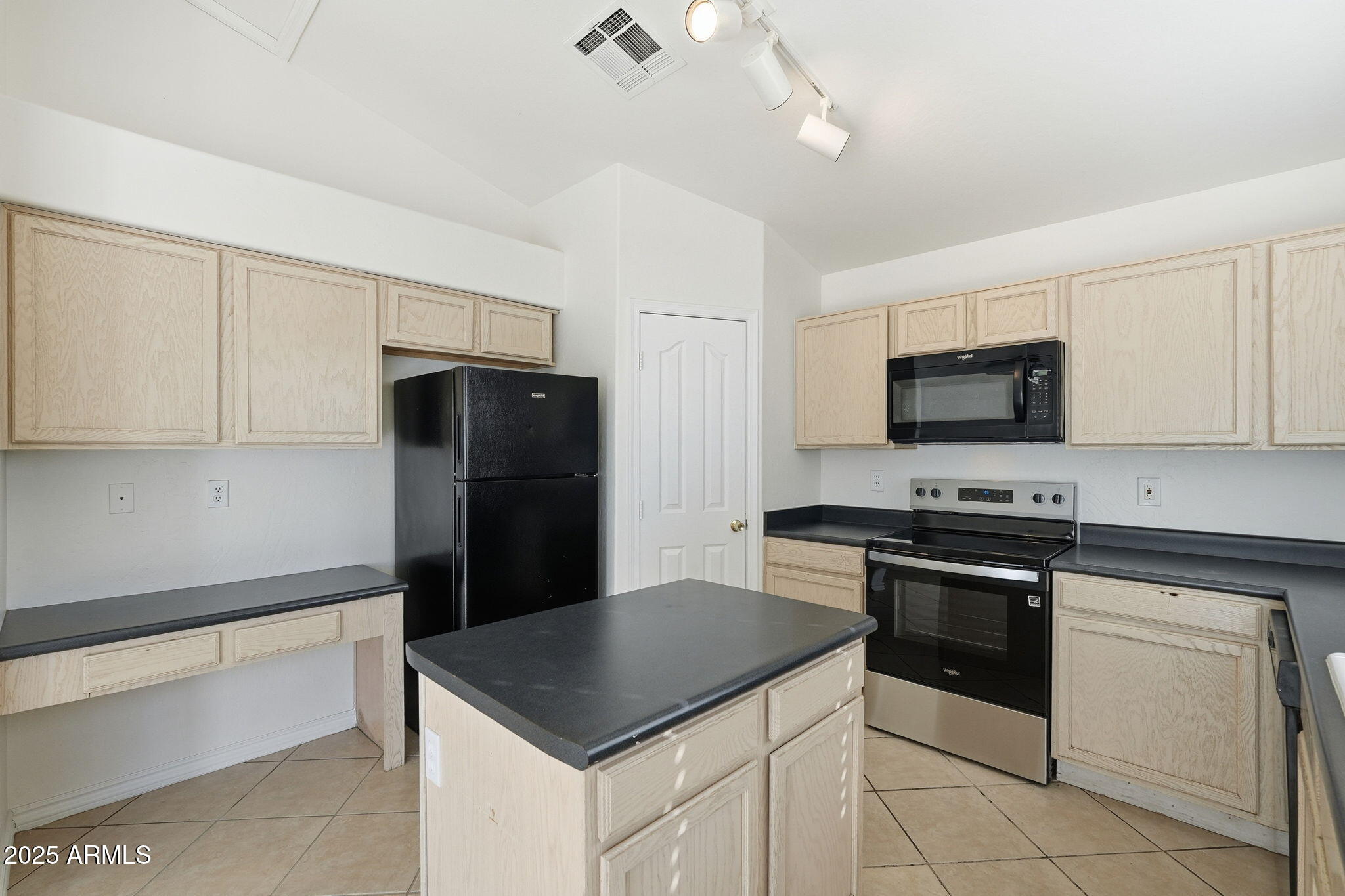 2061 East Appaloosa Road Gilbert, AZ 85296 - Photo 12 of 37 a kitchen with stainless steel appliances a stove microwave and refrigerator