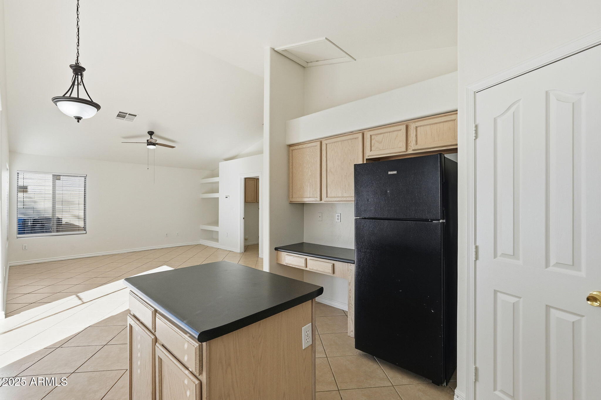 2061 East Appaloosa Road Gilbert, AZ 85296 - Photo 13 of 37 a kitchen with a refrigerator and a sink