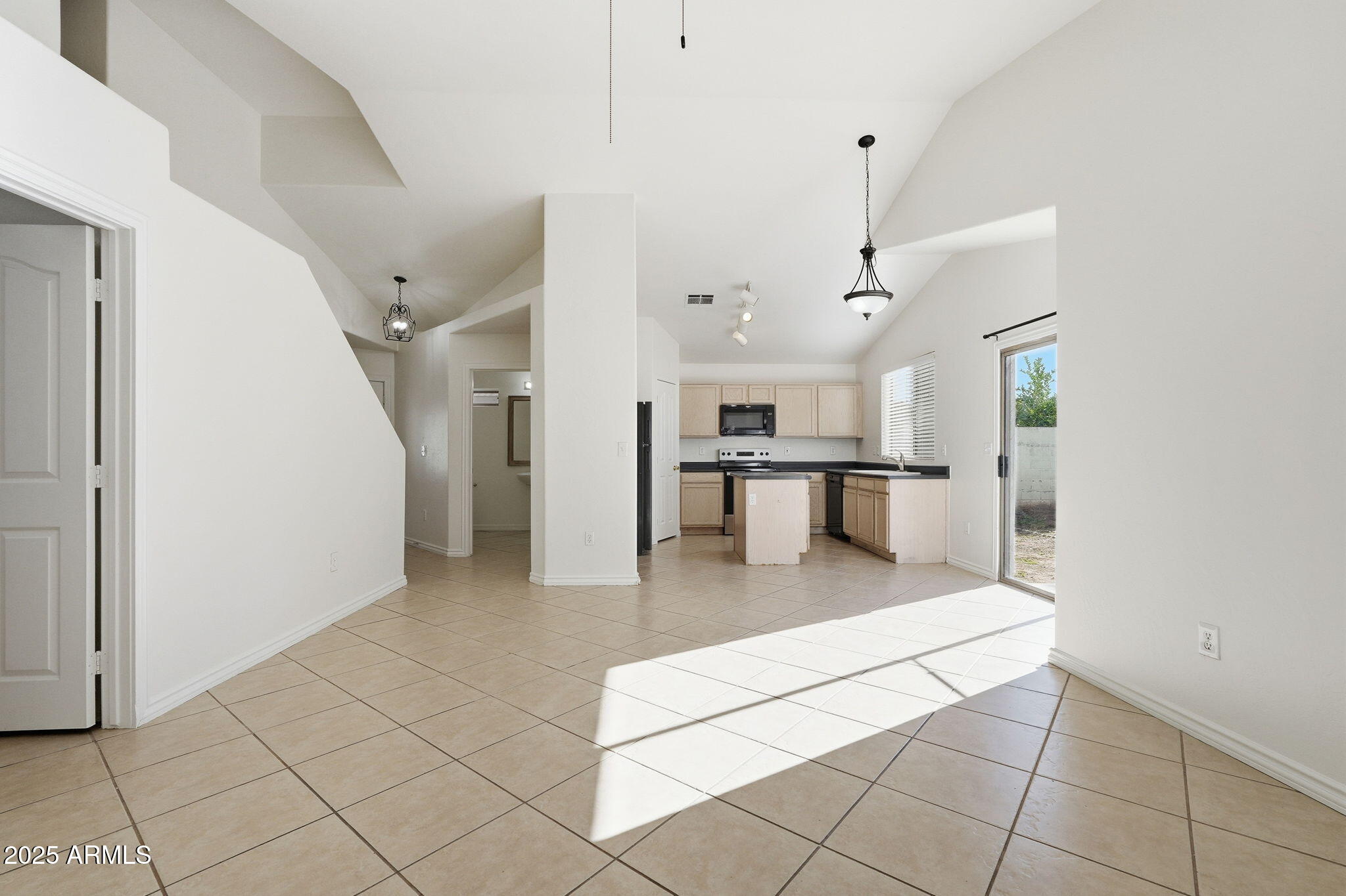 2061 East Appaloosa Road Gilbert, AZ 85296 - Photo 15 of 37 a open kitchen with cabinets and stainless steel appliances