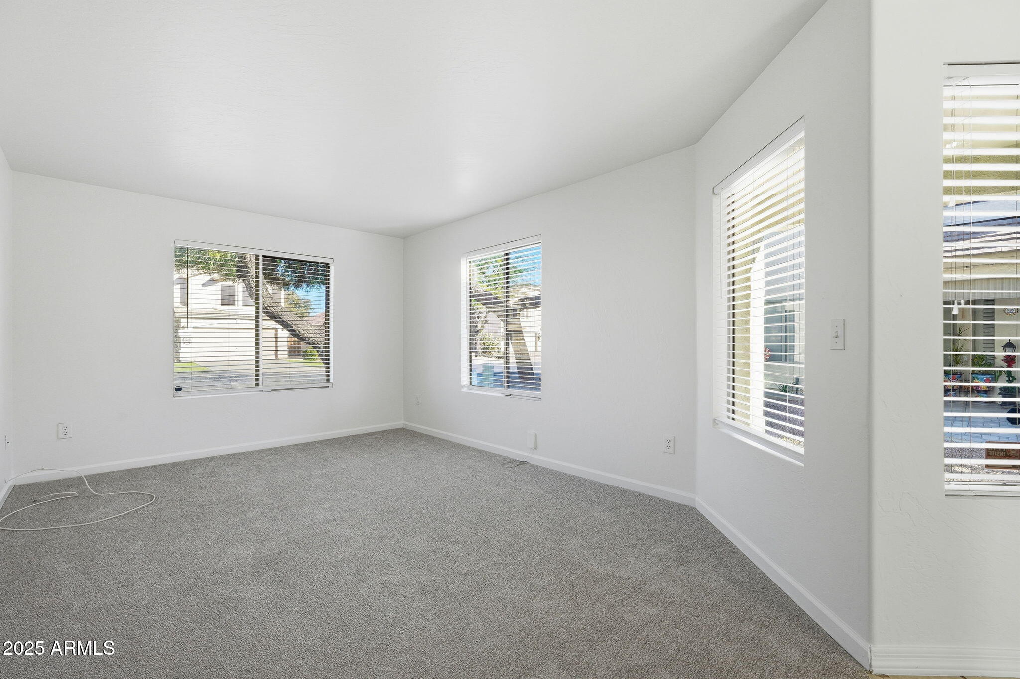 2061 East Appaloosa Road Gilbert, AZ 85296 - Photo 16 of 37 a view of an empty room with windows