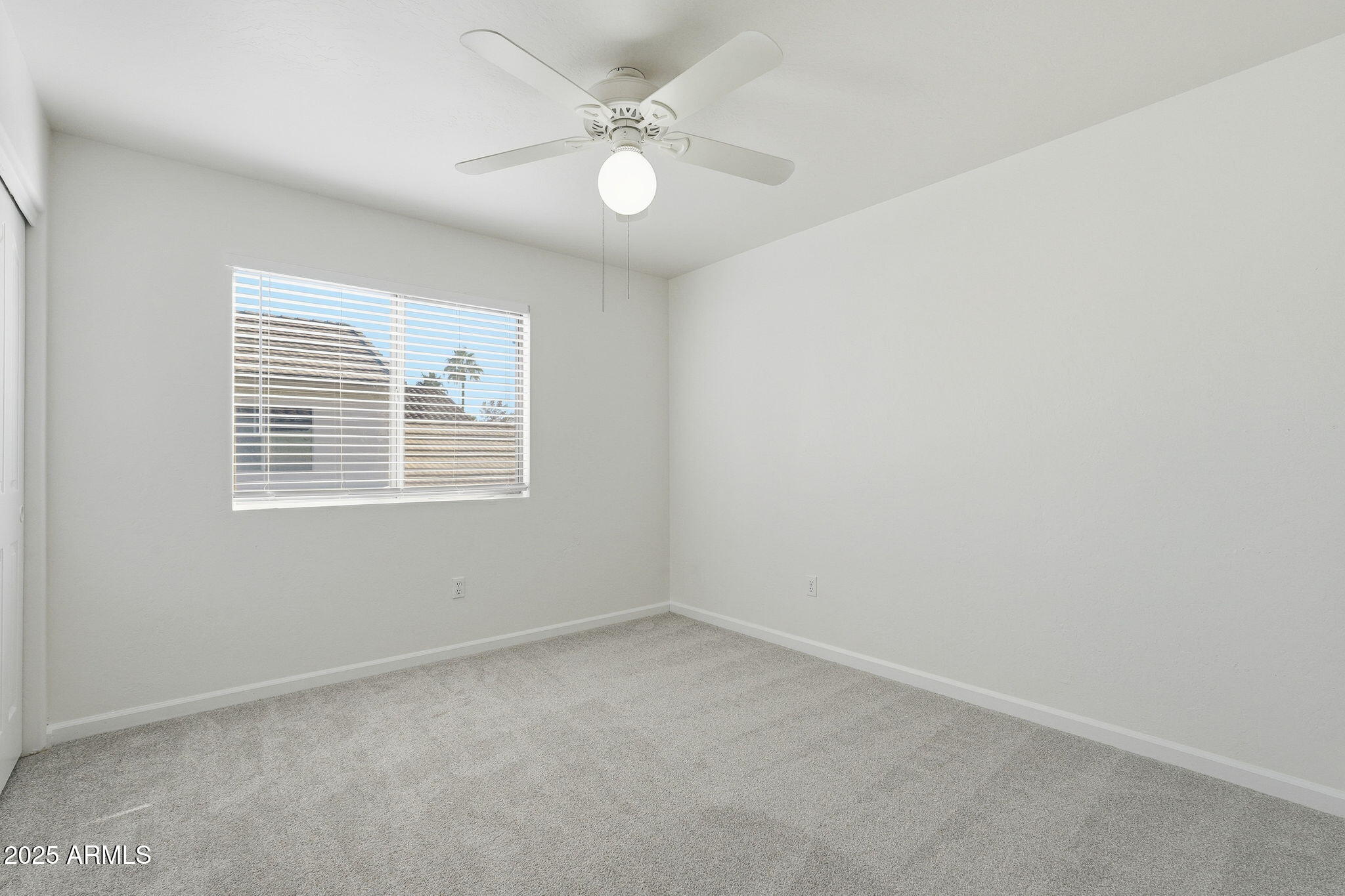 2061 East Appaloosa Road Gilbert, AZ 85296 - Photo 18 of 37 an empty room with windows and fan