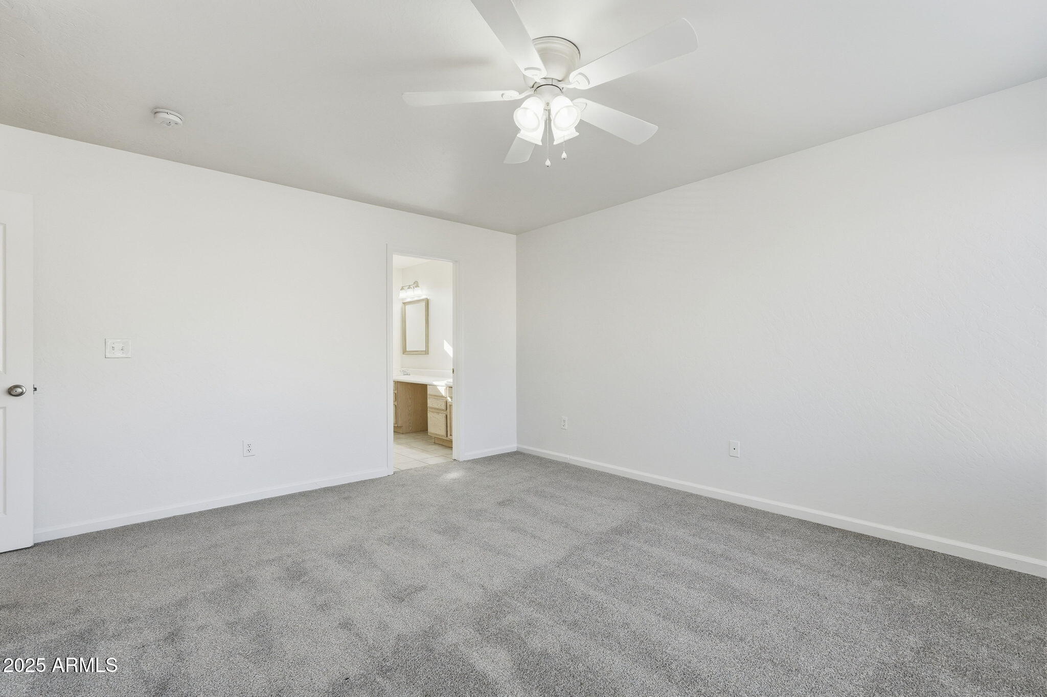 2061 East Appaloosa Road Gilbert, AZ 85296 - Photo 21 of 37 an empty room with a ceiling fan and a window