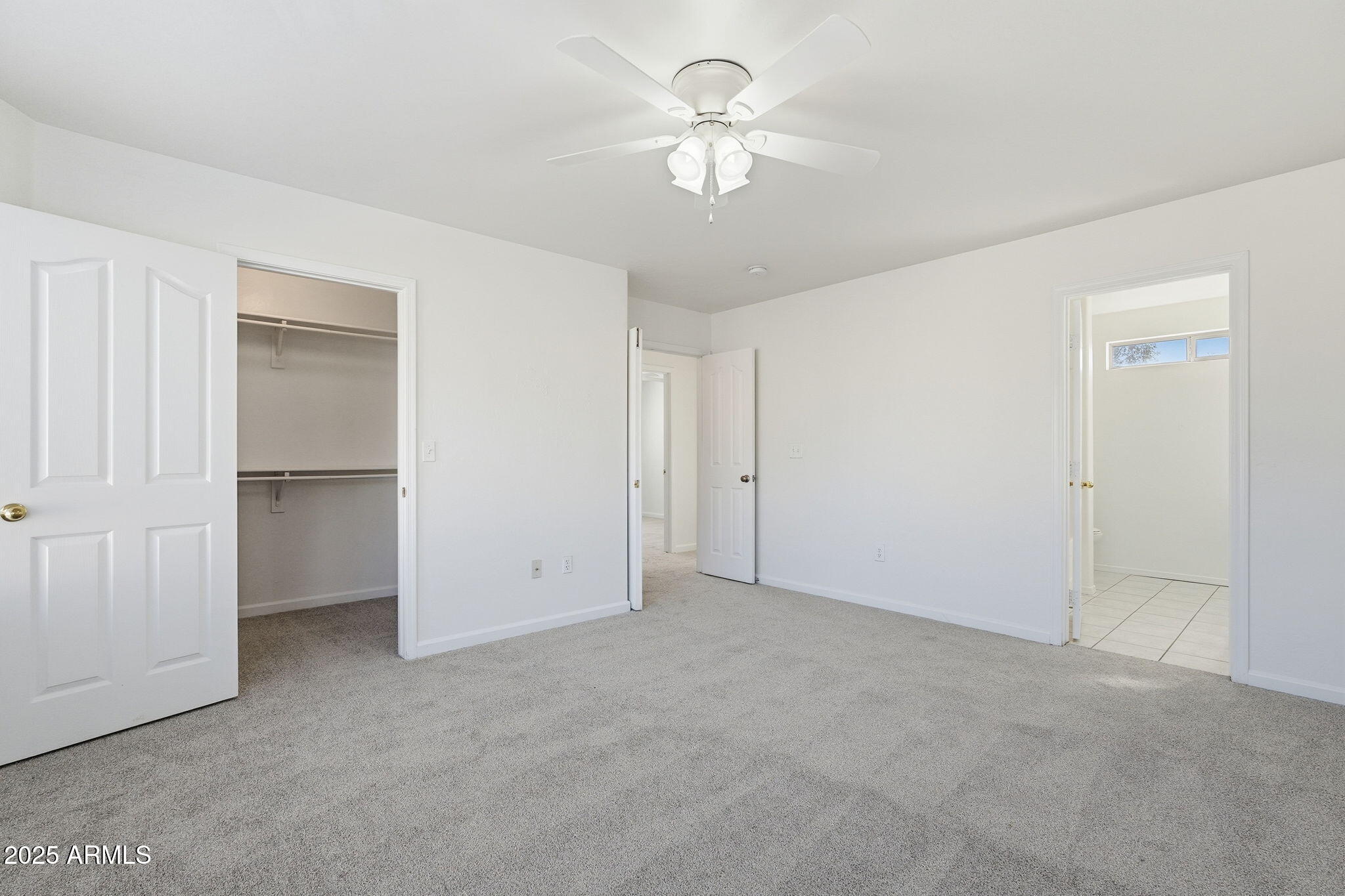 2061 East Appaloosa Road Gilbert, AZ 85296 - Photo 22 of 37 a view of an empty room with a ceiling fan