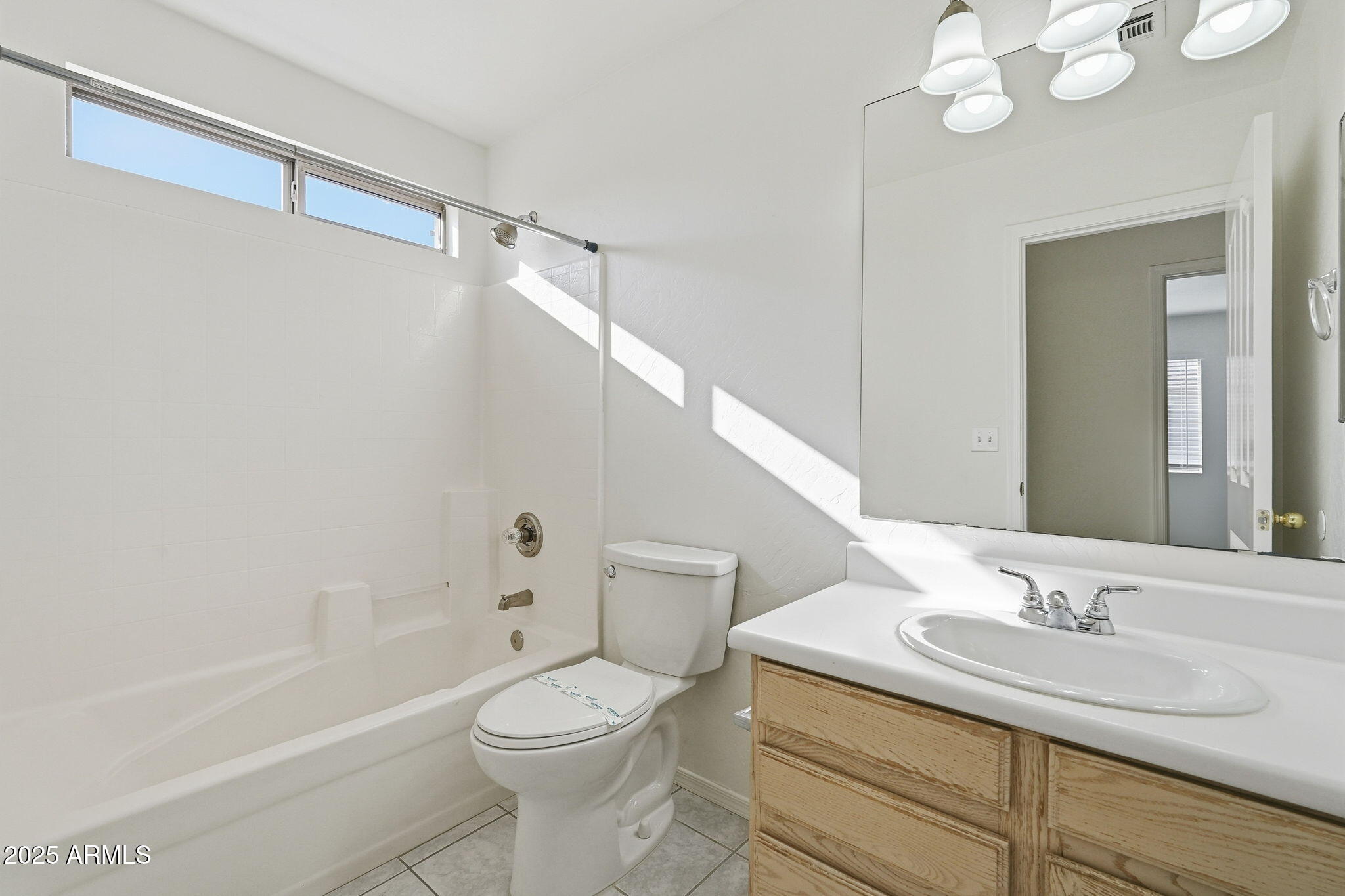 2061 East Appaloosa Road Gilbert, AZ 85296 - Photo 26 of 37 a bathroom with a granite countertop sink a toilet and shower