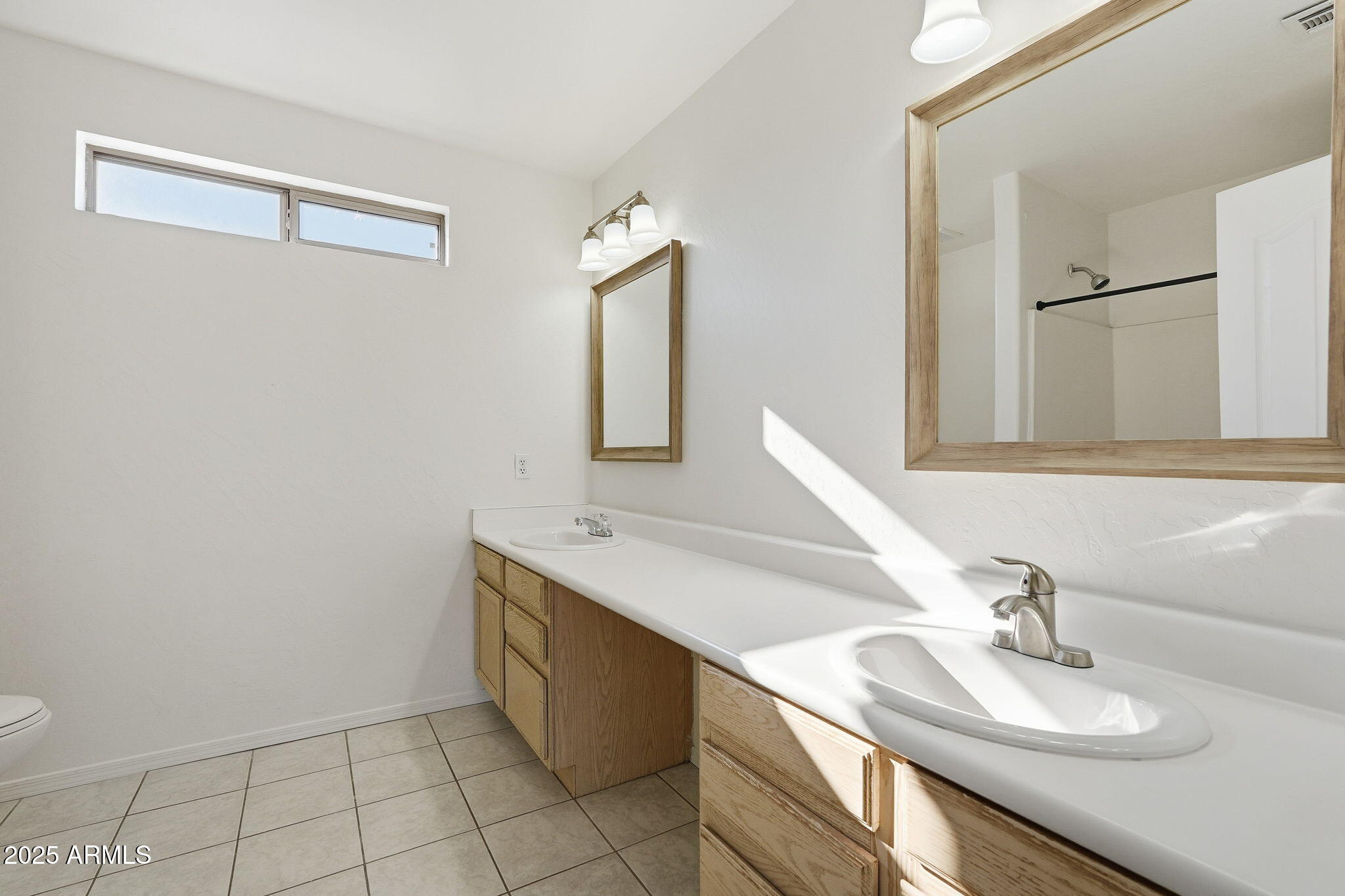 2061 East Appaloosa Road Gilbert, AZ 85296 - Photo 27 of 37 a bathroom with a sink and a mirror