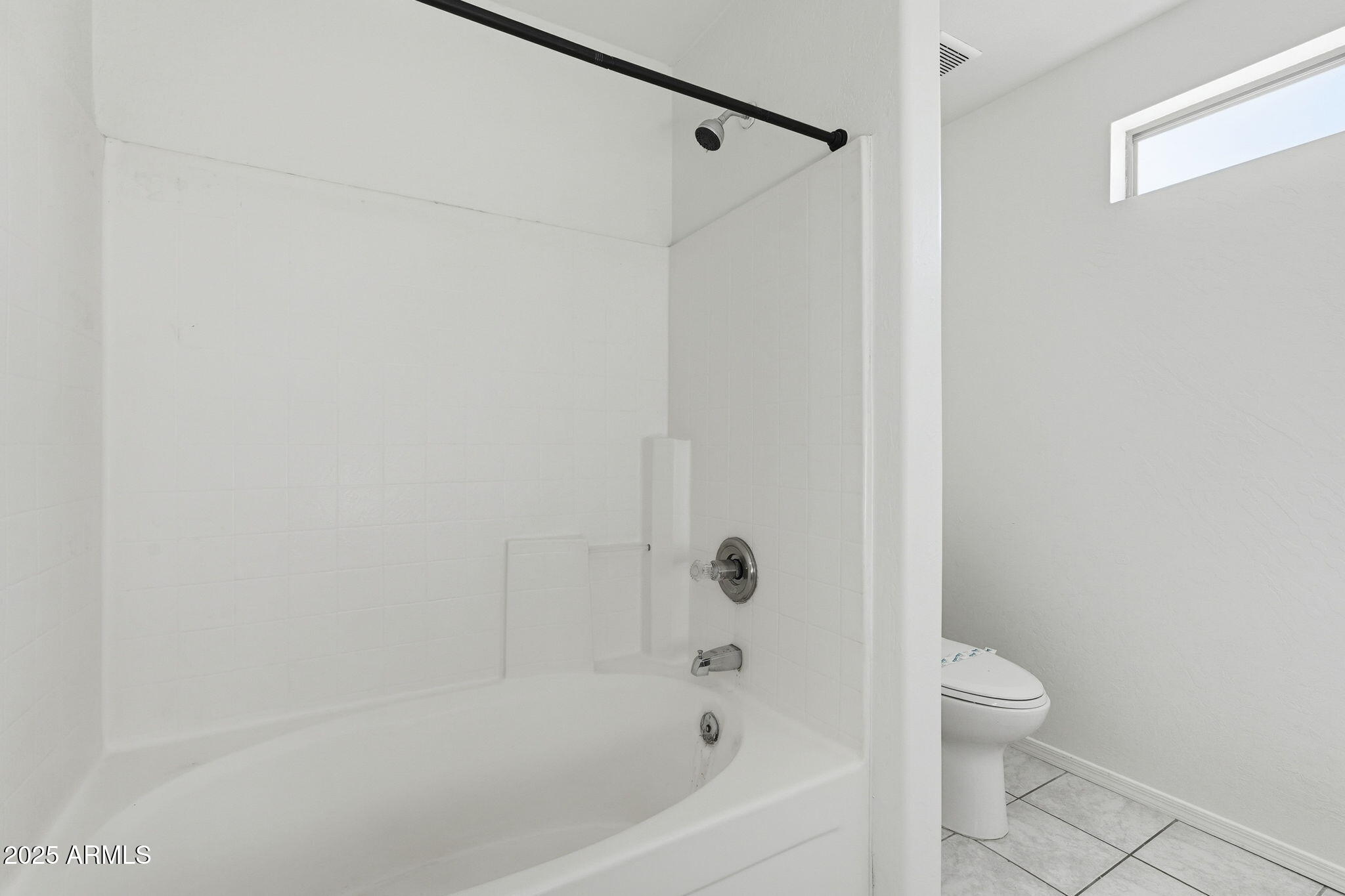 2061 East Appaloosa Road Gilbert, AZ 85296 - Photo 28 of 37 a bathroom with a bathtub and a shower