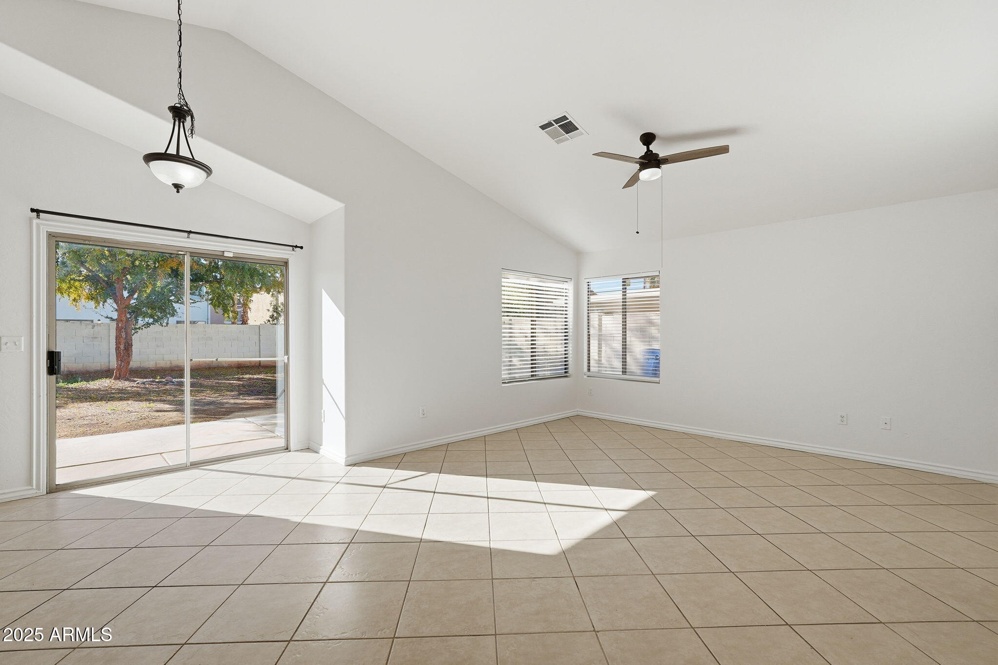 2061 East Appaloosa Road Gilbert, AZ 85296 - Photo 4 of 37 a view of an empty room with a window