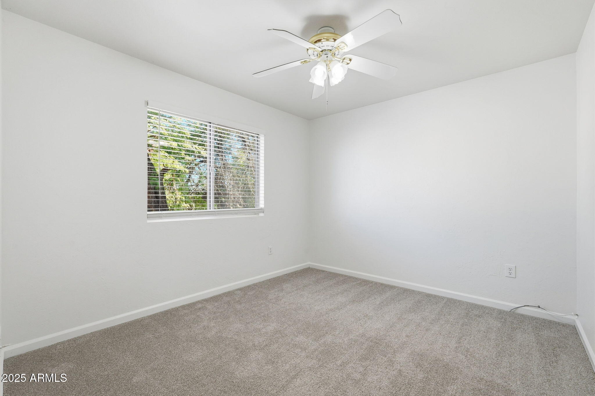 2061 East Appaloosa Road Gilbert, AZ 85296 - Photo 6 of 37 an empty room with a window