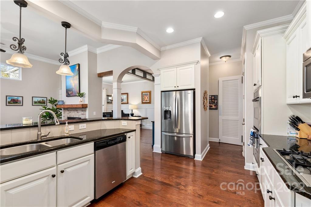 1235 Gold Rush Court Fort Mill, SC 29708 - Photo 17 of 42 a kitchen with granite countertop a refrigerator and a sink