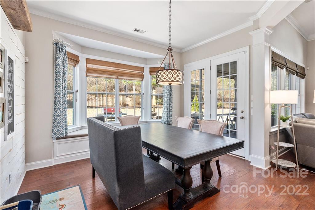 1235 Gold Rush Court Fort Mill, SC 29708 - Photo 18 of 42 a view of a dining room with furniture window and wooden floor